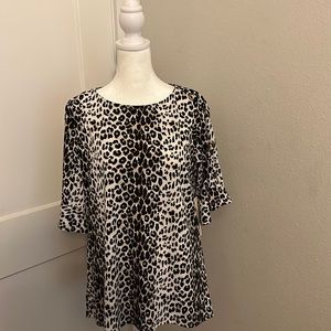 Animal print top with ruffle sleeves w/ gold cross cross design